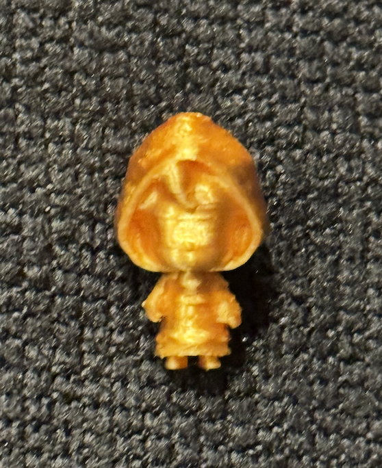 BixbyMini gold figurine of Bixby the necromancer from WordMaxed